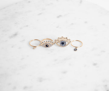 Four Pack Rhinestone Eye Design Rings